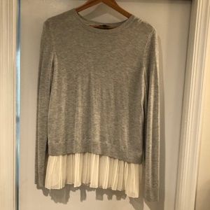 grey split back sweater with sheer underlay